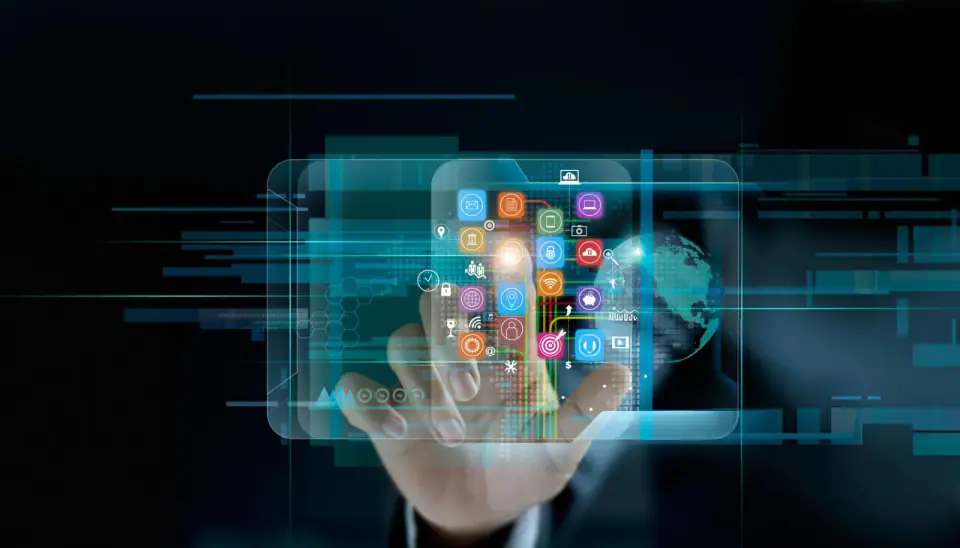 A hand reaches toward a floating panel of colorful application icons on a dark digital background